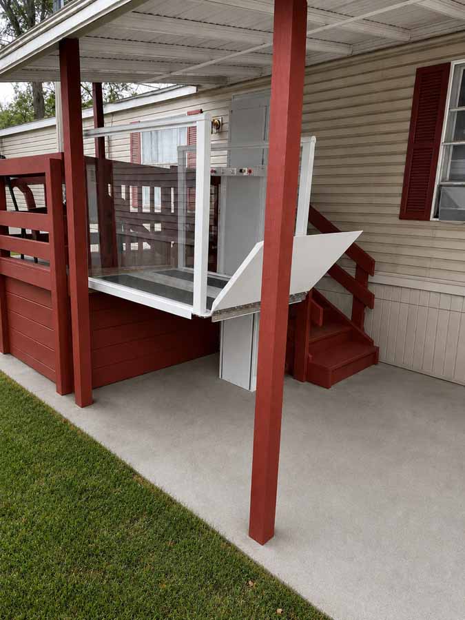 Nano vertical platform lift installed under a shelter
